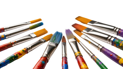 Obraz premium Isolated artist paintbrushes with colorful paint-splattered handles for creative painting projects