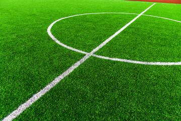 Fototapeta premium Center of football green field with white line and circle. Sport background concept.