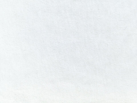 minimalist white knitted cotton fabric texture creates a serene bright backdrop for sustainable design