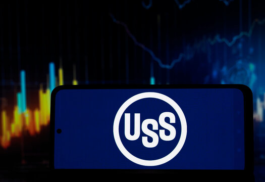 In this photo illustration,  The United States Steel Corporation logo seen displayed on a smartphone.