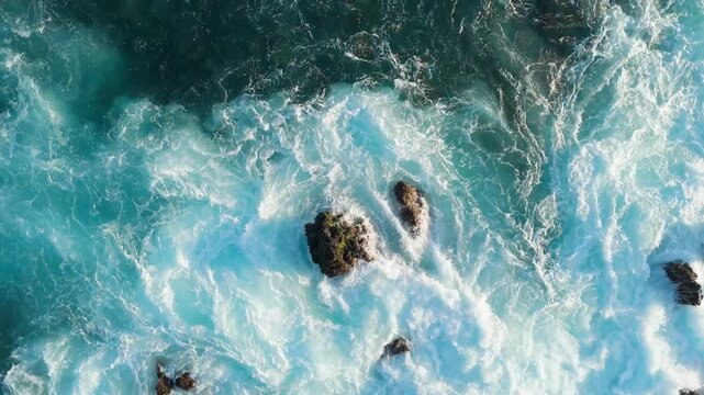 Aerial top view waves crashing on volcanic lava coastline, Tenerife