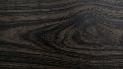 Fototapeta premium Dark wood texture with natural grain patterns and swirling lines