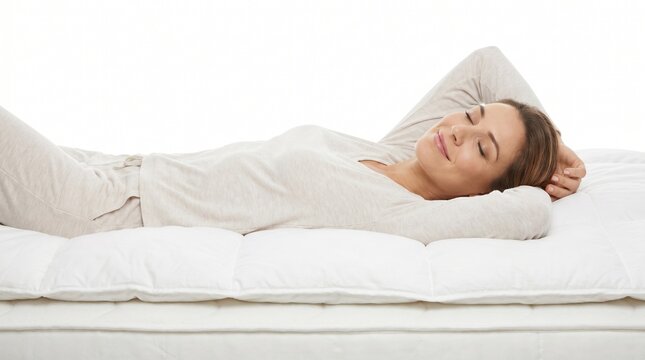 Woman peacefully sleeping on a comfortable mattress, enjoying restful slumber