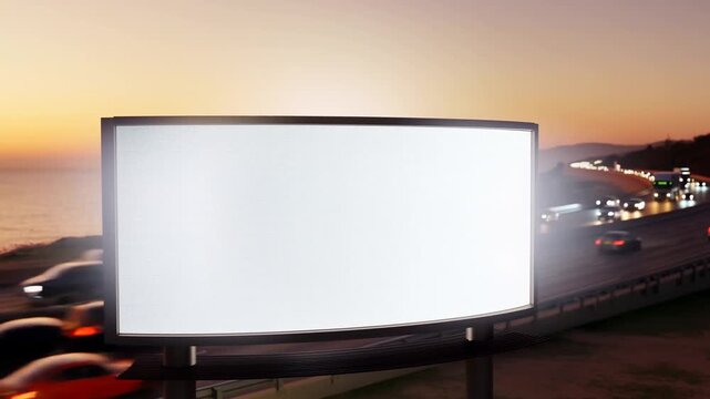 Sunset highway billboard lights up against a scenic beachside drive