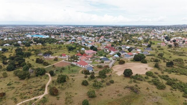 Dar Es Salaam Tanzania - 26 June 2026 - Aerial view of Kigamboni Dar es Salaam showcasing residential settlements houses green landscapes and expanding urban development in Tanzania