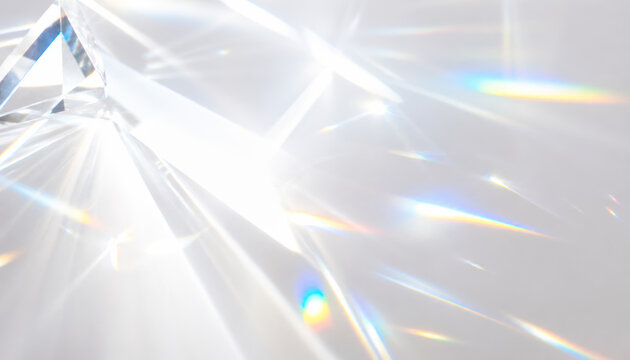 Close-up of crystal prism reflecting beautiful rainbow colors
