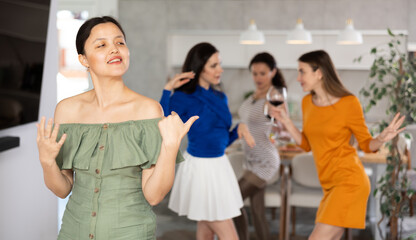 Fototapeta premium Happy women dancing at a bachelorette party - girlfriends home party