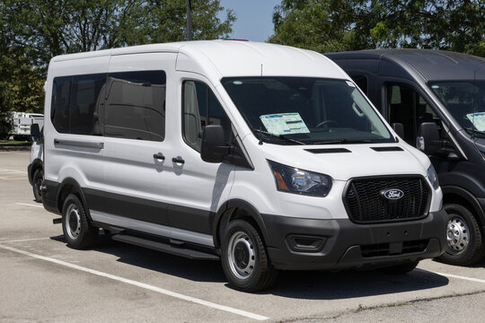 Ford Transit T-350 MR Passenger RWD van at a dealership. Ford offers the Transit T350 with a 3.5L PFDI V6 Gas engine. MY:2026