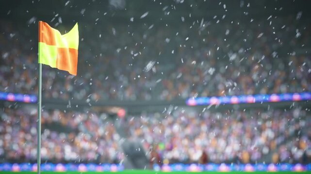 Animation of snowflakes falling over corner flag on frozen football stadium pitch with audience in background cheering. 3D render close up of corner post on soccer playground during snowy winter night