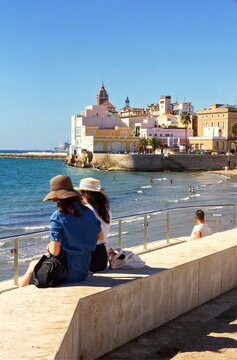 Tourists overlooking the beach, Sitges, Spain