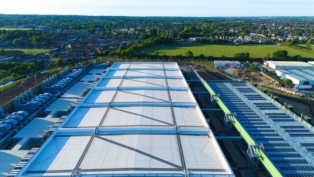Aerial view of the Google Data Centre Waltham Cross with its large industrial rooftops and cooling infrastructure under a clear sky in Cheshunt, England, United Kingdom.