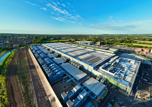 Aerial view of the Google Data Centre - Waltham Cross with modern industrial architecture, cooling systems and solar panels in Cheshunt, England, United Kingdom.
