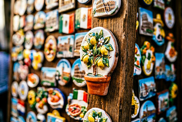 Fototapeta premium Ceramic lemon tree souvenir magnet displayed for sale at italian market
