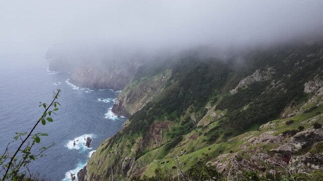 Static shot of dramatic ocean cliffs along Vereda do Larano trail in Madeira