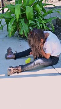 little girl playing with her toy chick