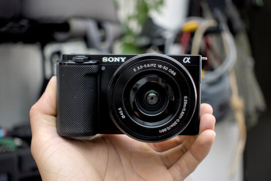 Zapopan Jalisco, Mexico - June 3 , 2026: Sony ZV-E10 mirrorless camera with 16-50mm lens held by a hand close up