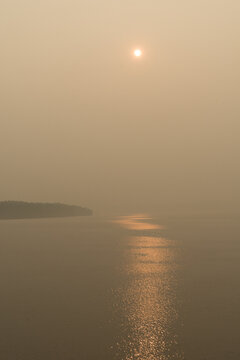 Canada, BC, Gulf Islands,  The sun and the view obscured by forest fire smoke