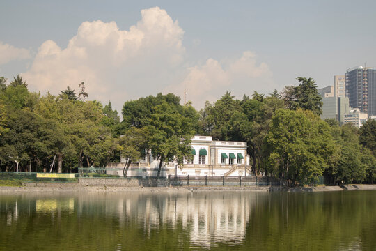 lake house in Chapultepec, Mexico City. Panoramic view of a calm lake with reflections of a classic
