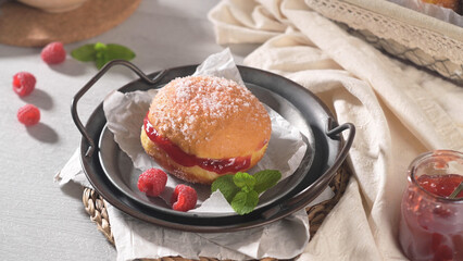 Sugar Dusted Jelly Donut with Fresh Raspberries and Mint on a Vintage Tray © homydesign