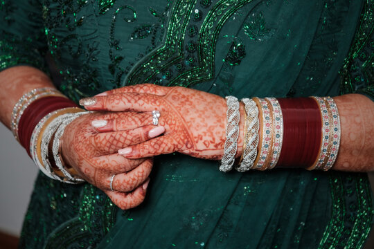 Indian Bride's Hands with Henna and Traditional Bangles