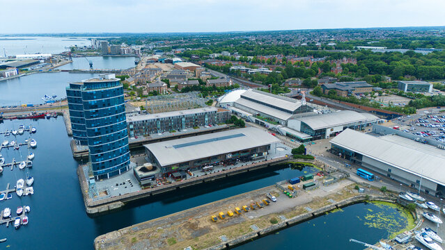 Aerial view of Saint Mary's Island featuring the modern blue glass tower, the marina with moored boats, and the Dockside Outlet Centre in Rochester, England, United Kingdom.