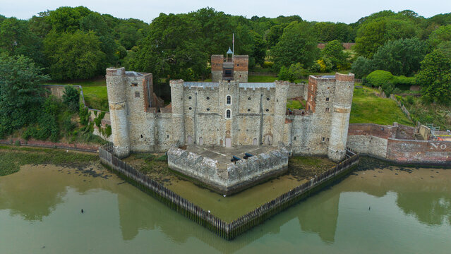 Aerial view of Upnor Castle, an Elizabethan artillery fort featuring stone walls and circular towers on the banks of the River Medway in Upper Upnor, England, United Kingdom.