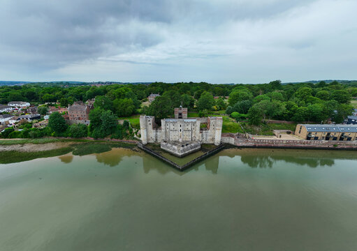 Aerial view of Upnor Castle on the banks of the River Medway with surrounding green trees and a cloudy sky Upper Upnor, England, United Kingdom.