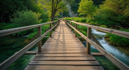 Fototapeta premium Wooden Bridge Over a Serene Forest Stream Amidst Lush Greenery.