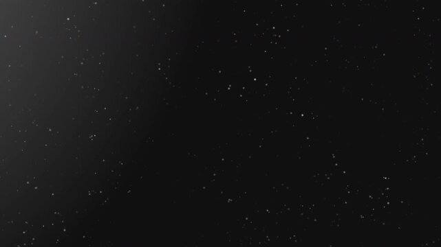 4K video | Organic falling of simple dust particles on black background for overlay on cinematic video project.
