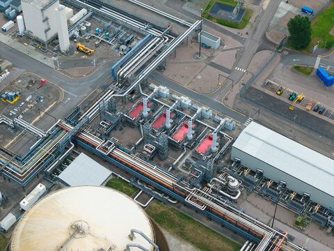 Aerial view of Grain LNG terminal with its intricate network of industrial pipes, storage tanks, and processing facilities in Wallend, England, United Kingdom.