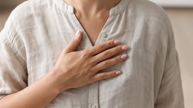 Person Holding Hand Over Chest Gesture. 4K Video