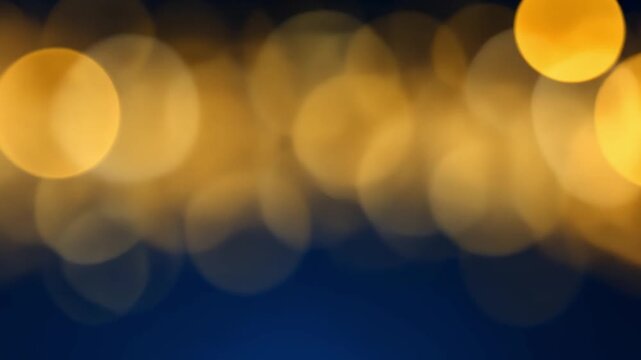 Abstract golden light bokeh effect on dark background for design