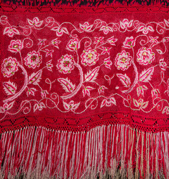 The fringe of a traditional Ecuadorian macana (shawl), a handicraft from the province of Azuay. This garment is an essential part of the Chola Cuencana folk attire, cultural heritage from Cuenca