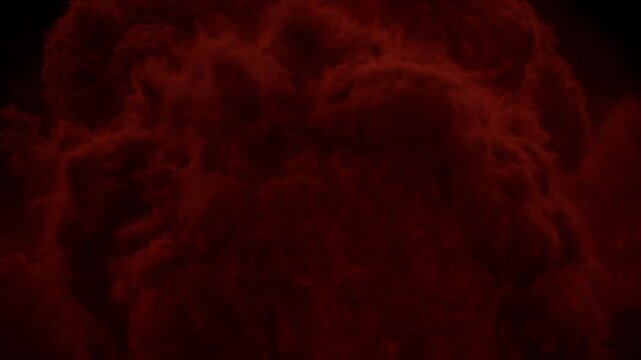 Red smoke cloud on dark background, abstract crimson mist plume, dramatic black background explosion texture