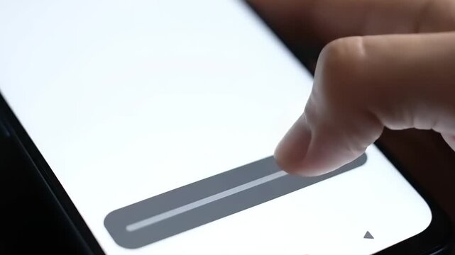 Close-up of a finger interacting with a modern smartphone screen, smoothly adjusting a digital slider bar, showcasing intuitive user control and mobile technology engagement