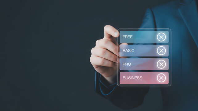 Close up of a businessman's hand selecting a service plan option from a glowing digital interface with 'free' 'basic' 'pro'
