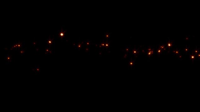 christmas lights background. Golden sparkling light particles moving forward across an abstract flat surface isolated on black background