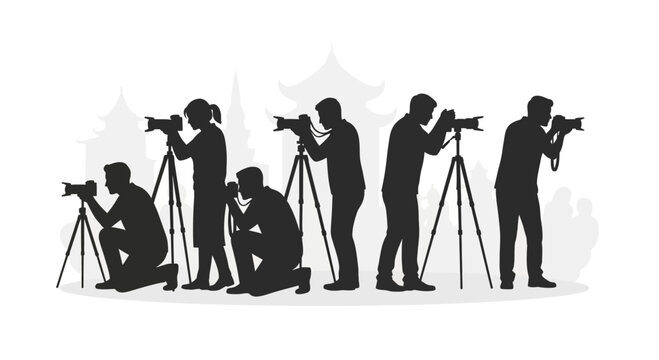 Silhouettes of professional photographers capturing images with cameras and tripods.