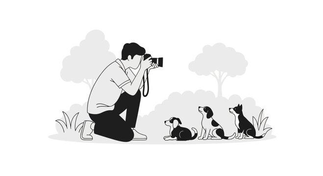 A photographer kneeling down to take a picture of three cute puppies outdoors.