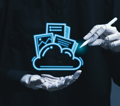 Robot hand managing digital files with cloud computing technology.
