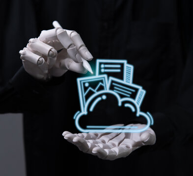 Robot hand managing digital files with cloud computing technology.