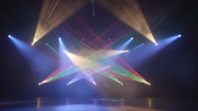 Stage lighting with multi-colored laser beams and spotlights.