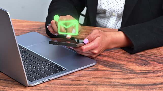 Woman hands holding a smartphone with a holographic email notification icon