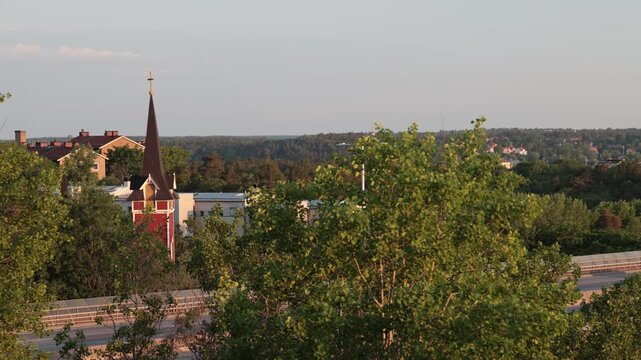 Stockholm, Sweden A sunrise over the elevated Essingeleden and E4 highway and the S:t Sigfrids kyrka. 