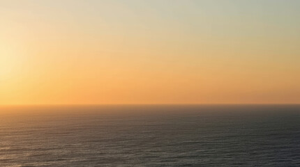 Obraz premium Minimalist ocean horizon under warm golden light calm sea and soft sky