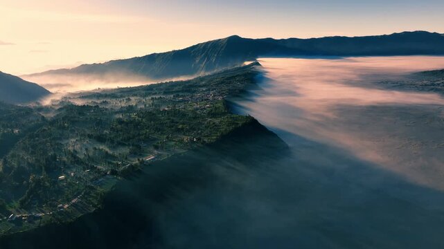 Aerial view of the area surrounding Mount Bromo (Gunung Bromo) during sunrise in Bromo Tengger Semeru National Park, East Java, Indonesia.
