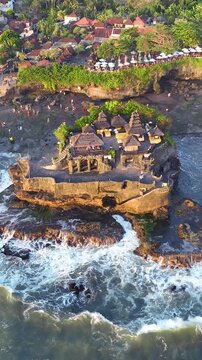 Vertical video, Aerial view of Tanah Lot Temple in Bali, Indonesia.