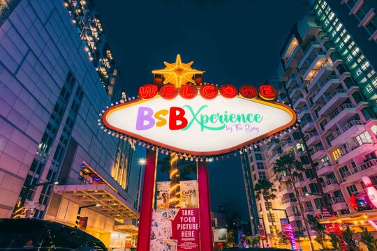 Las Vegas style welcome sign at night in a modern city BSB plaza