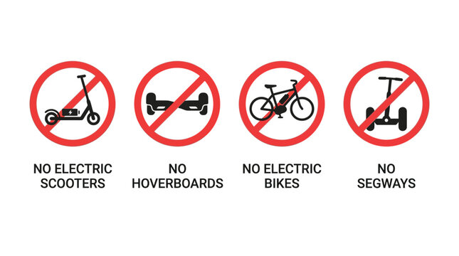 Four circular red prohibition signs forbidding electric scooters hoverboards electric bikes and personal transport segway devices