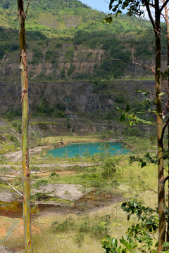 Turquoise water lake inside Panguna mine pit on tropical island Autonomous Region of Bougainville, Papua New Guinea